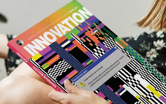 a woman reads innovation magazine