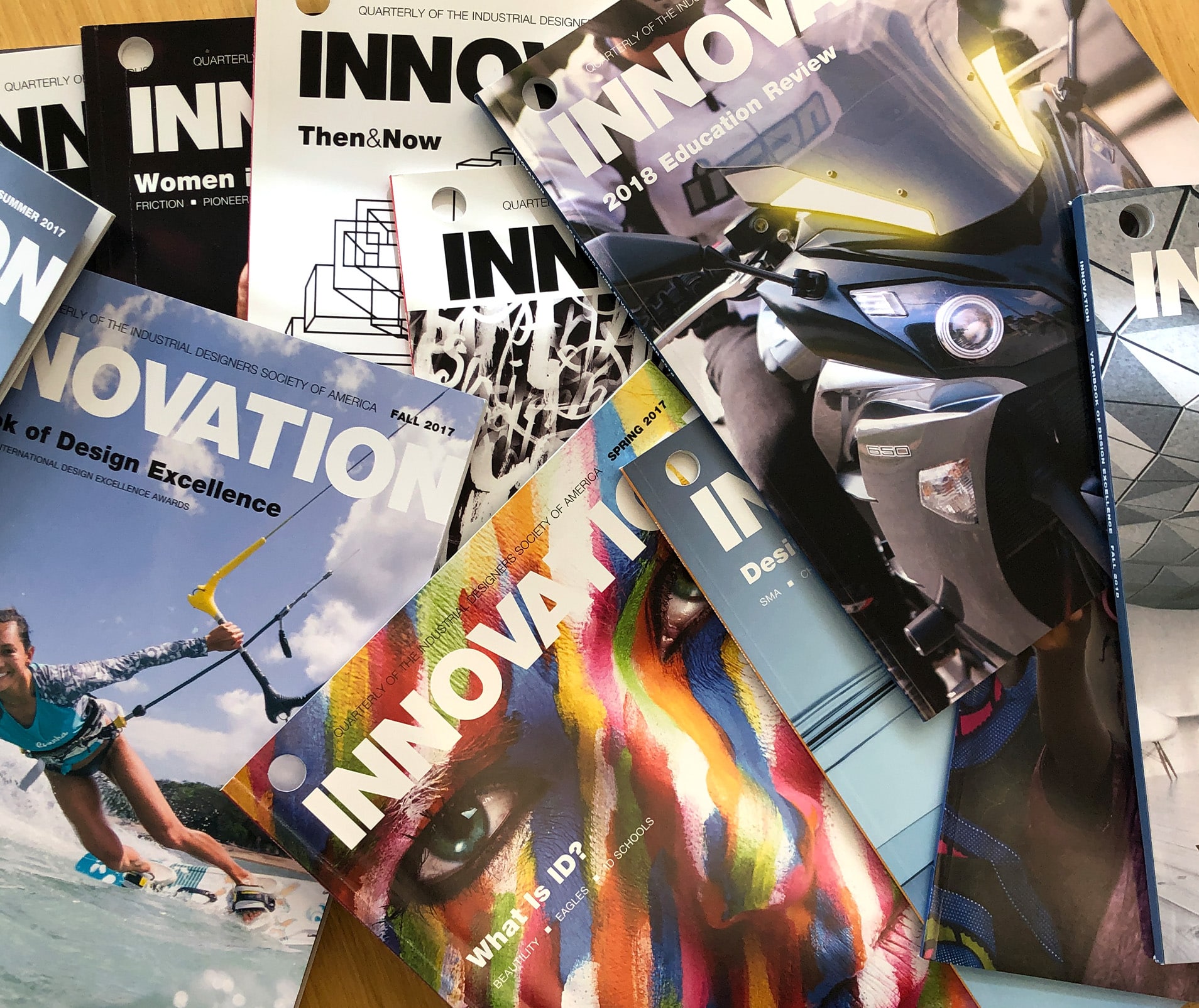 A stack of INNOVATION magazines on a desk
